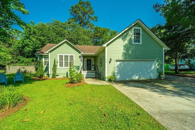 view of front of house featuring a front lawn and a garage