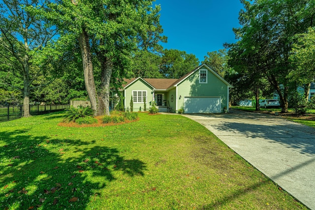 view of front of property featuring a garage and a front lawn