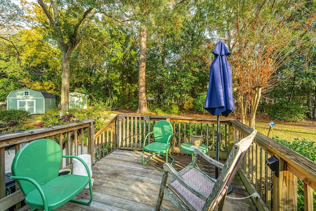 wooden terrace with a storage unit