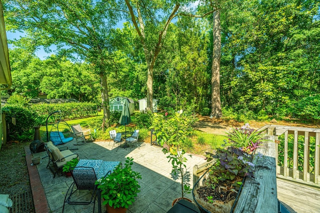 view of patio / terrace featuring a storage unit