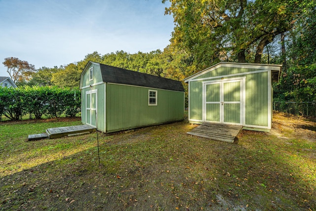 view of outdoor structure featuring a yard