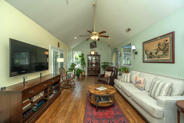 living room with dark hardwood / wood-style flooring, vaulted ceiling, and ceiling fan