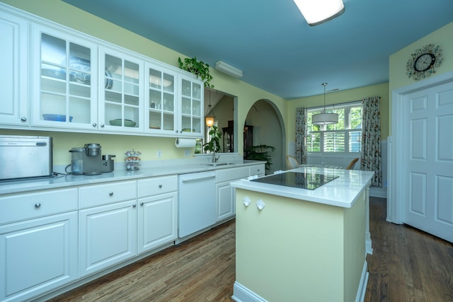 kitchen featuring dark wood-type flooring, white dishwasher, white cabinets, black electric stovetop, and a kitchen island