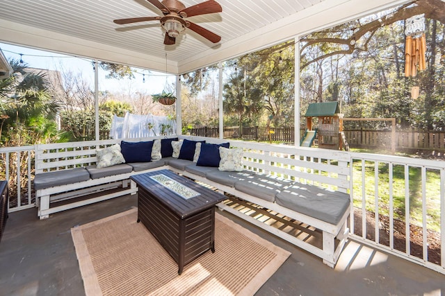 view of patio / terrace featuring a playground and an outdoor living space with a fire pit