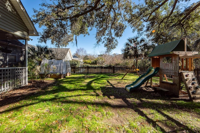 view of yard featuring a playground and a trampoline