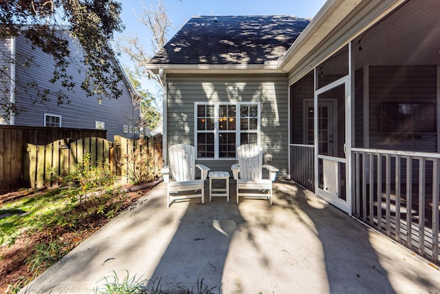 view of patio / terrace with a sunroom