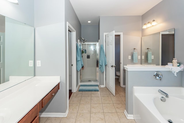 full bathroom featuring tile patterned floors, vanity, independent shower and bath, and toilet