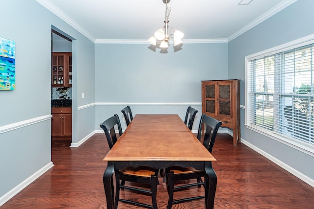 dining space with ornamental molding, dark wood-type flooring, and a notable chandelier