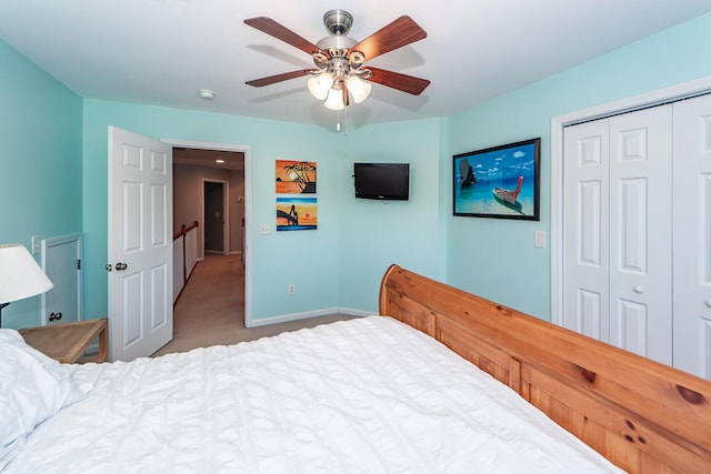 bedroom featuring light carpet, a closet, and ceiling fan