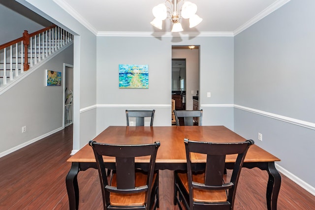 dining room with dark hardwood / wood-style flooring, ornamental molding, and an inviting chandelier