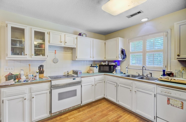 4 Garth Dr, Charleston, SC 29414 - kitchen with a sink, white appliances, a textured ceiling, decorative backsplash, and white cabinets