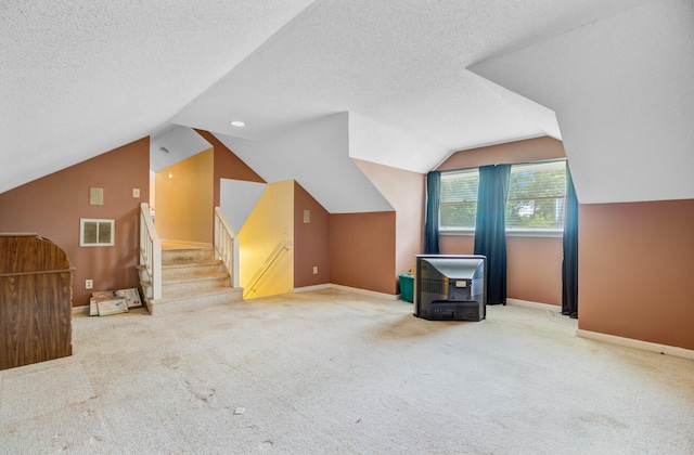 4 Garth Dr, Charleston, SC 29414 - bonus room featuring lofted ceiling, carpet flooring, baseboards, a textured ceiling, and stairs
