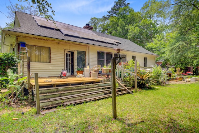 4 Garth Dr, Charleston, SC 29414 - back of property with a chimney, a lawn, and solar panels