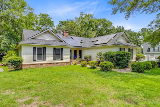 4 Garth Dr, Charleston, SC 29414 - view of front facade featuring a front yard, solar panels, a chimney, and a shingled roof