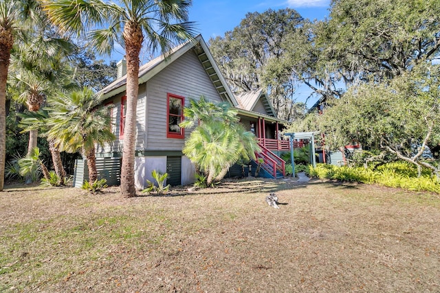 view of home's exterior featuring a yard