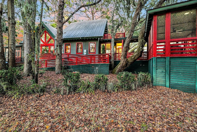 playground at dusk with ceiling fan and a wooden deck