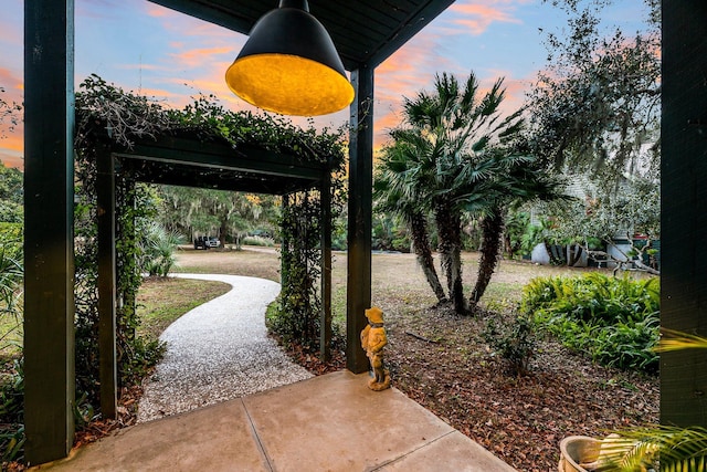 view of patio terrace at dusk