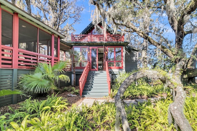 view of front facade with a sunroom