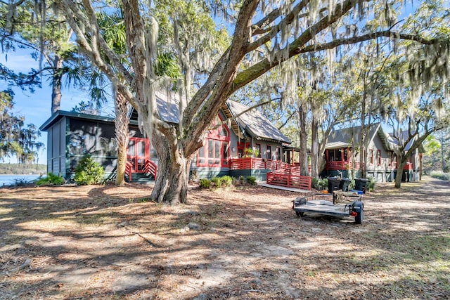 view of front of house with a sunroom