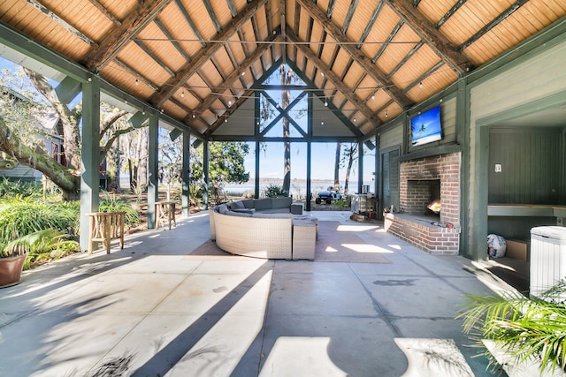 view of patio / terrace with a gazebo and an outdoor living space with a fireplace