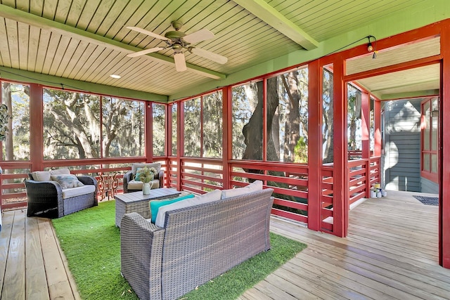 deck featuring ceiling fan and an outdoor living space