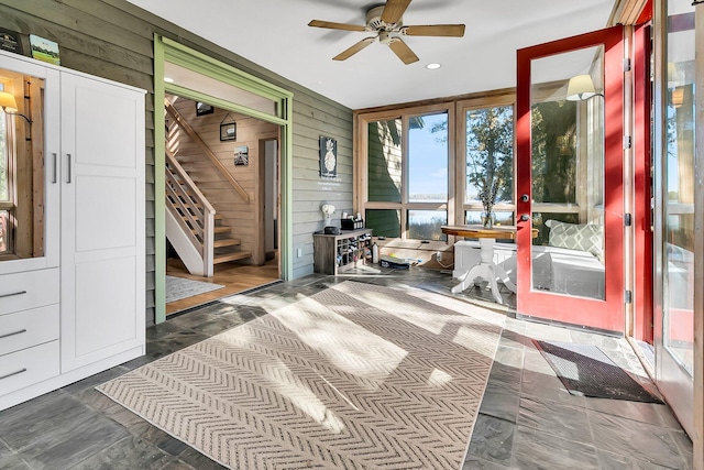 sunroom / solarium featuring ceiling fan