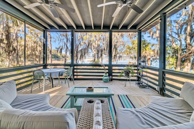 unfurnished sunroom with plenty of natural light and ceiling fan