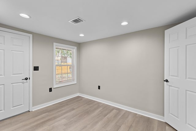 interior space featuring recessed lighting, visible vents, light wood-style flooring, and baseboards