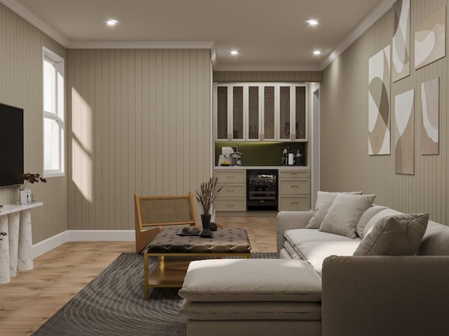 living room featuring light hardwood / wood-style flooring, ornamental molding, and beverage cooler