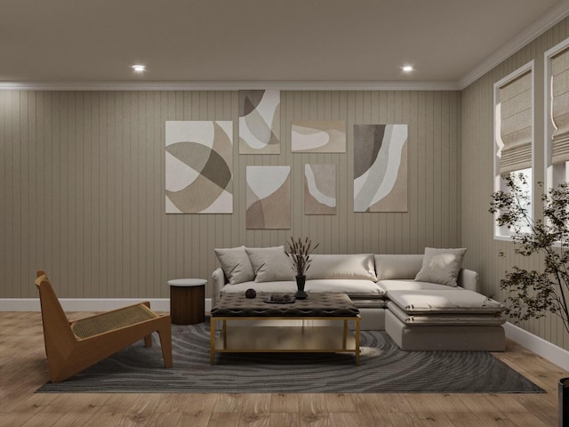 living area with crown molding and hardwood / wood-style flooring