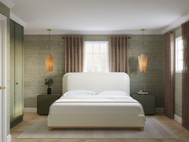 bedroom featuring crown molding and light hardwood / wood-style flooring