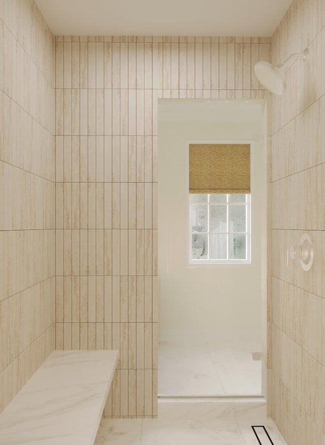 bathroom featuring tiled shower, tile walls, and tile patterned floors