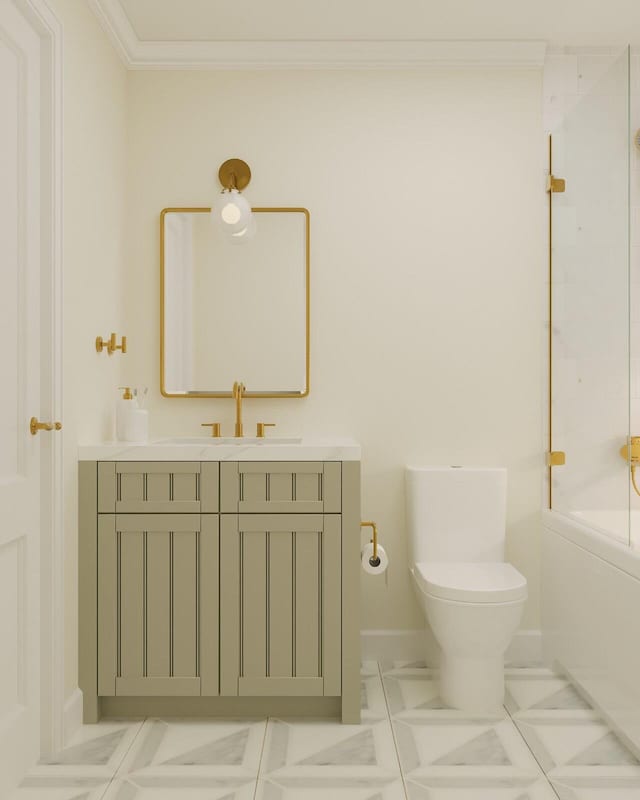 full bathroom featuring toilet, crown molding, tile patterned flooring, bathing tub / shower combination, and vanity