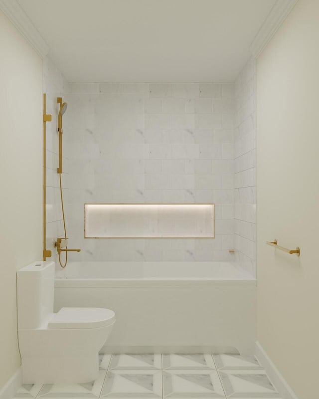 bathroom with tile patterned floors, toilet, tiled shower / bath, and crown molding