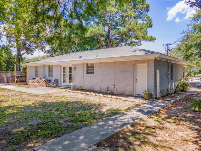 back of house featuring french doors and a patio