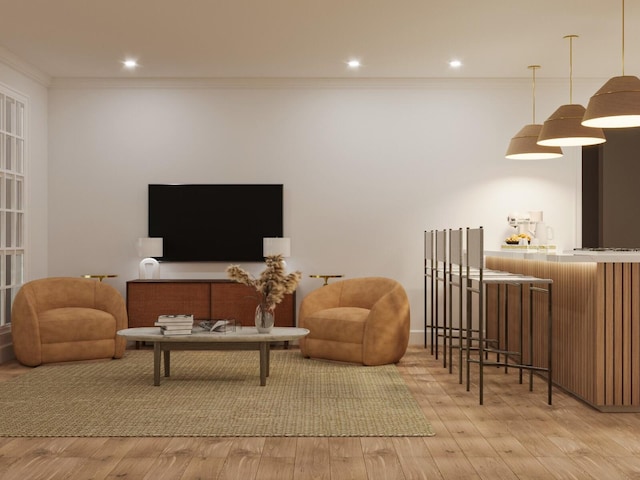 living room with light hardwood / wood-style flooring and ornamental molding