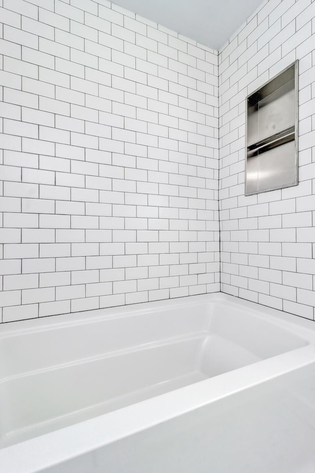 bathroom with a washtub