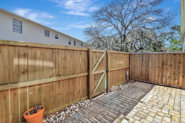 view of patio / terrace with a gate and fence