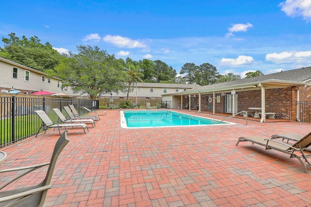 pool featuring a patio and fence