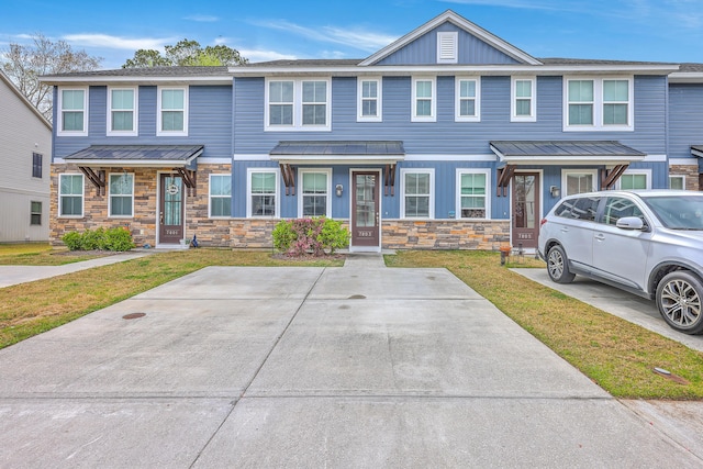 7803 Park Gate Dr, Charleston, SC 29418 - view of property featuring stone siding, a front lawn, and board and batten siding