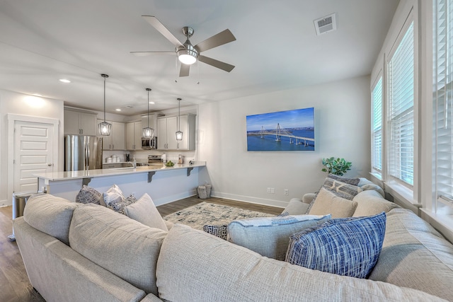 7803 Park Gate Dr, Charleston, SC 29418 - living room with dark wood-style floors, baseboards, visible vents, ceiling fan, and recessed lighting
