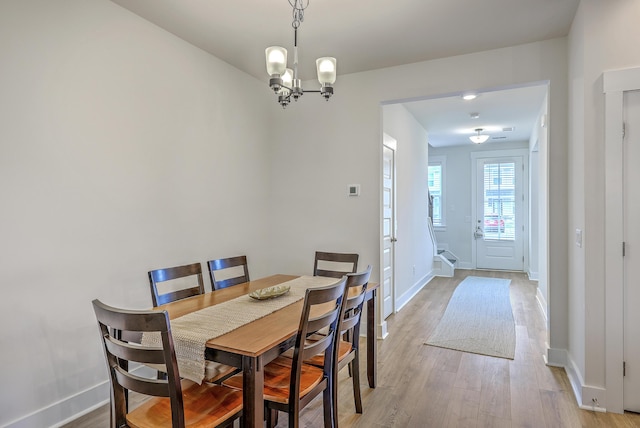 7803 Park Gate Dr, Charleston, SC 29418 - dining room featuring a chandelier, baseboards, and light wood finished floors