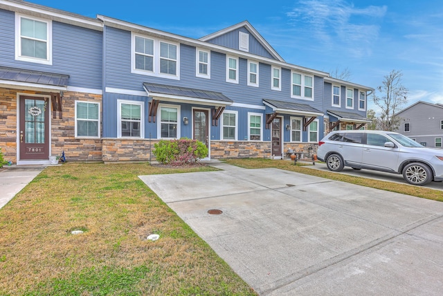 7803 Park Gate Dr, Charleston, SC 29418 - multi unit property with metal roof, a front yard, stone siding, and board and batten siding