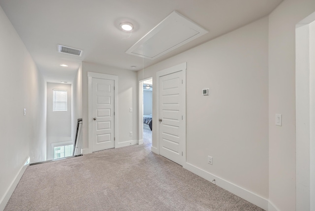 7803 Park Gate Dr, Charleston, SC 29418 - unfurnished room with carpet, baseboards, visible vents, and attic access