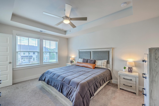 7803 Park Gate Dr, Charleston, SC 29418 - bedroom with a tray ceiling, baseboards, visible vents, and light carpet