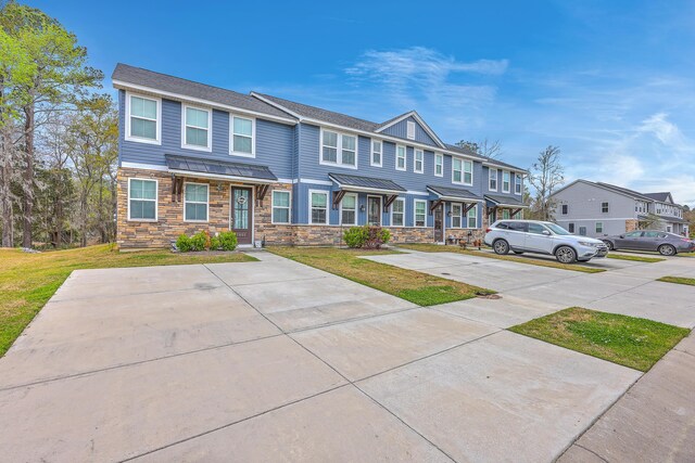 7803 Park Gate Dr, Charleston, SC 29418 - view of property featuring stone siding, a residential view, and a front yard