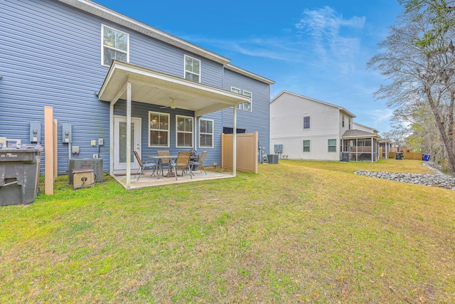 7803 Park Gate Dr, Charleston, SC 29418 - rear view of house with a ceiling fan, central AC unit, a patio area, and a lawn