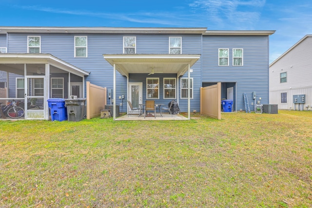 7803 Park Gate Dr, Charleston, SC 29418 - rear view of house featuring central air condition unit, a lawn, a sunroom, and a patio