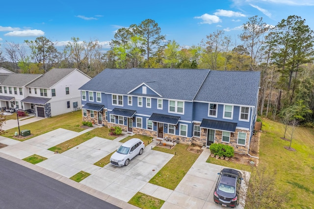 7803 Park Gate Dr, Charleston, SC 29418 - view of front of house featuring a shingled roof, a front yard, and stone siding