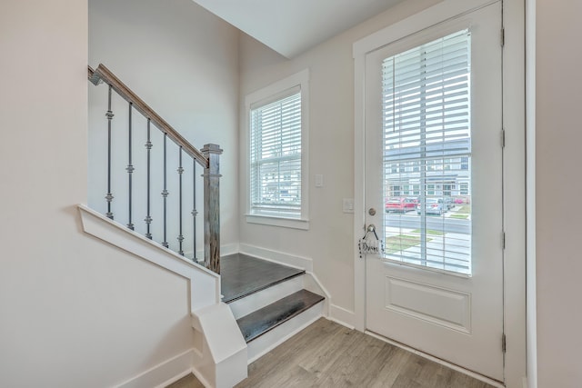 7803 Park Gate Dr, Charleston, SC 29418 - doorway with baseboards, stairs, and light wood finished floors